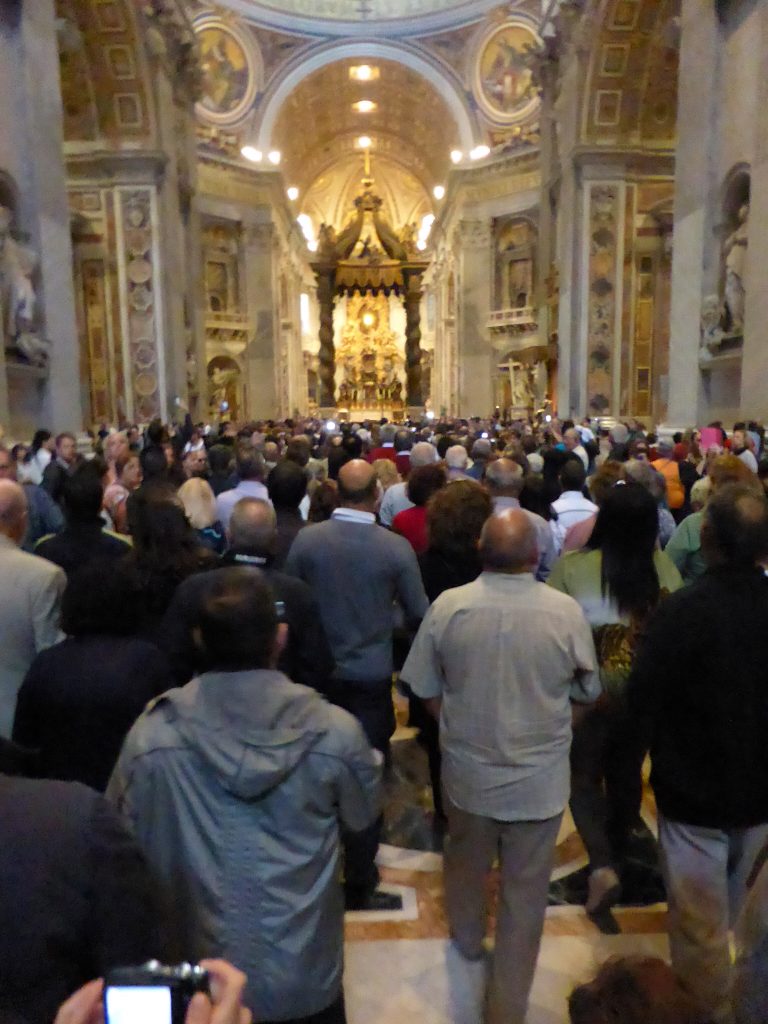 Huge crowd of people inside St. Peter's Basilica