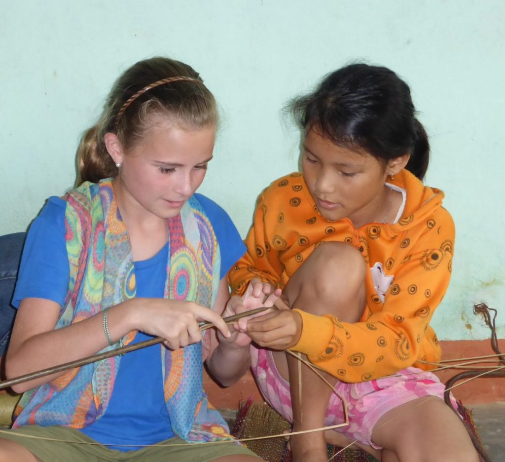 Two girls mat weaving Kim Bong Island