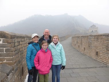 Family standing on the Mutianyu section of the Great Wall