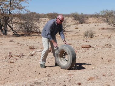 Rolling tire in Namibia desert