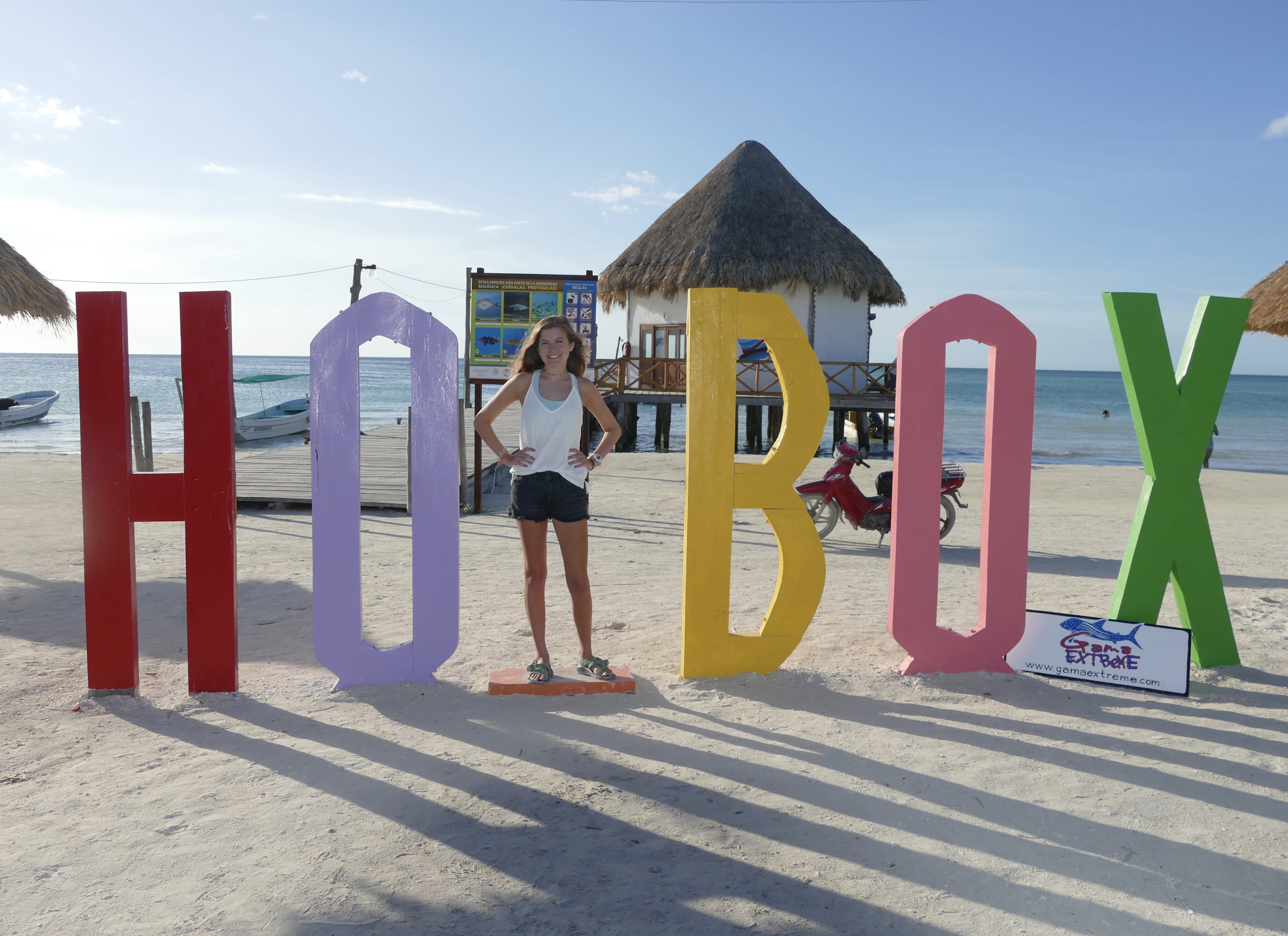 Life sized Holbox Island sign on the beach. The space for the "L" is blank so visitors can stand in its place for photo ops.