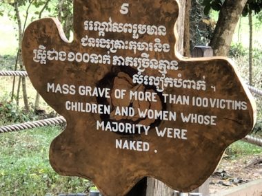 Killing Fields sign: mass grave of more than 100 victims children and women whose majority were naked