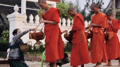 Monks collecting their morning alms